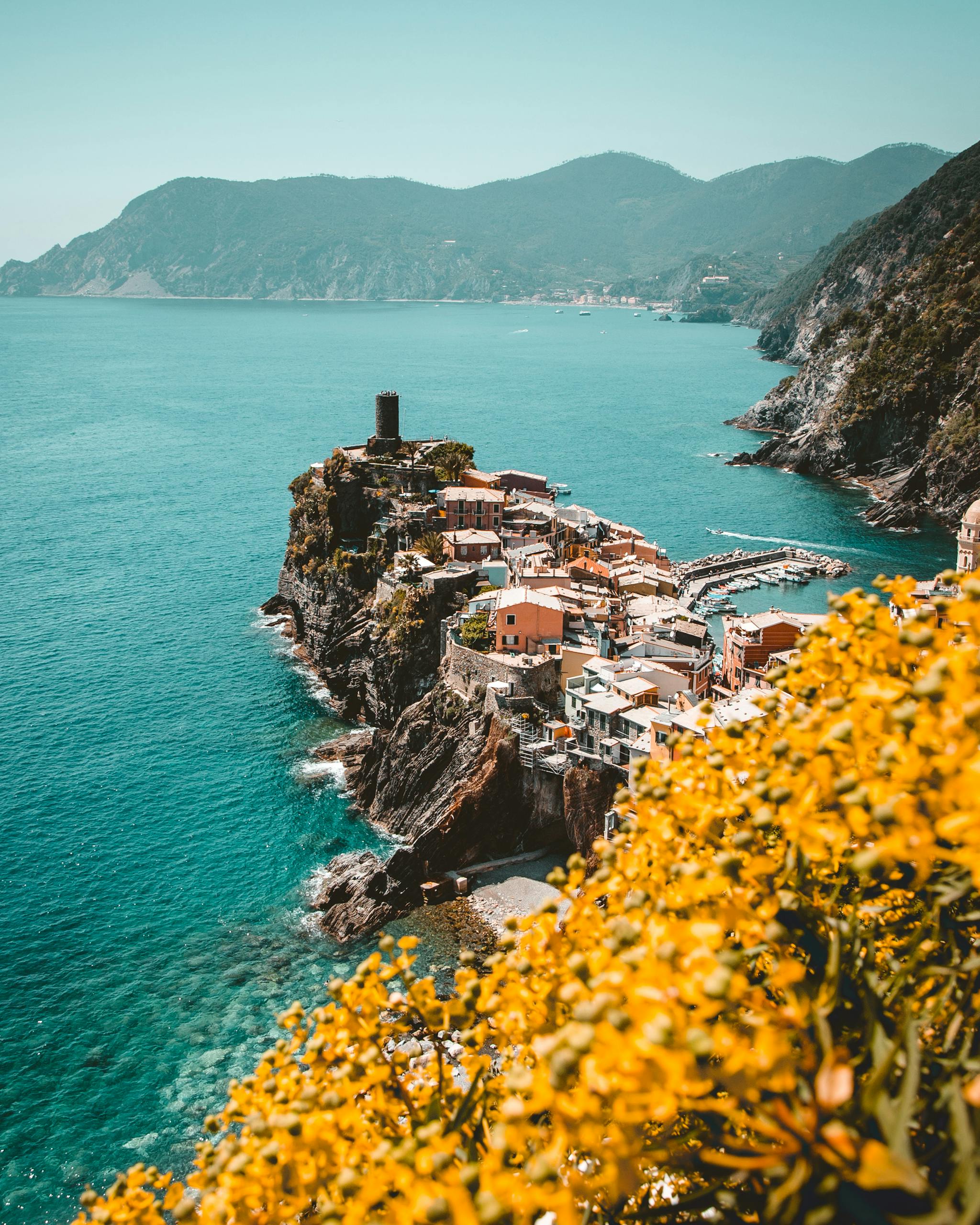 Stunning view of Vernazza with colorful houses on cliffs by the sea, Liguria, Italy.